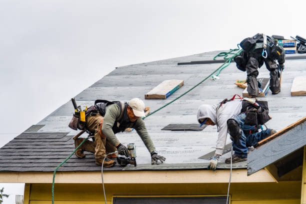 Professional Gutter Installation technician working in Stockton, KS